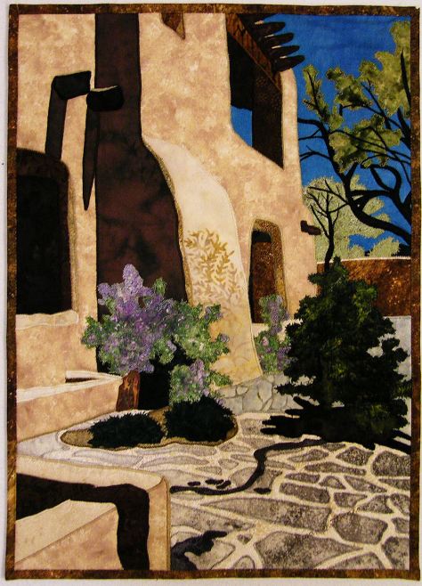 “Santa Fe Courtyard” by Susan Brittingham was inspired by the photo below.